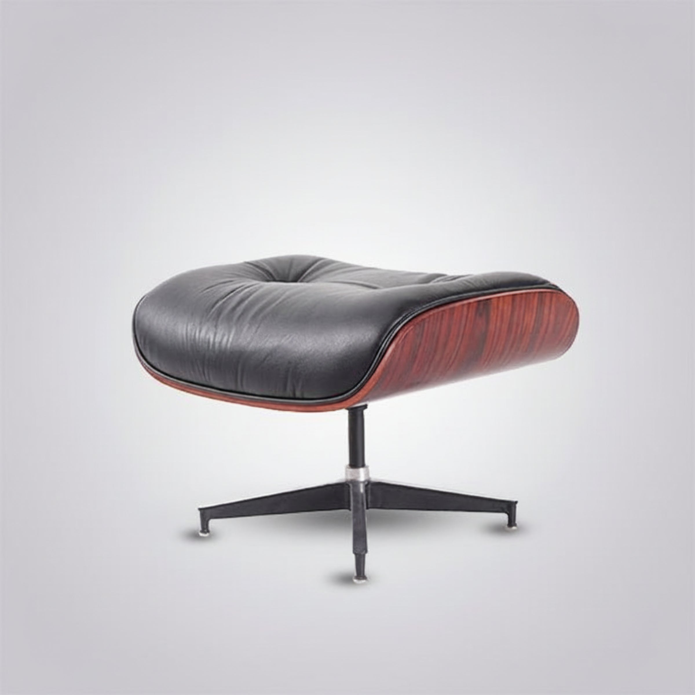 A modern lounge chair with a black leather cushioned seat and a reddish-brown wood veneer side