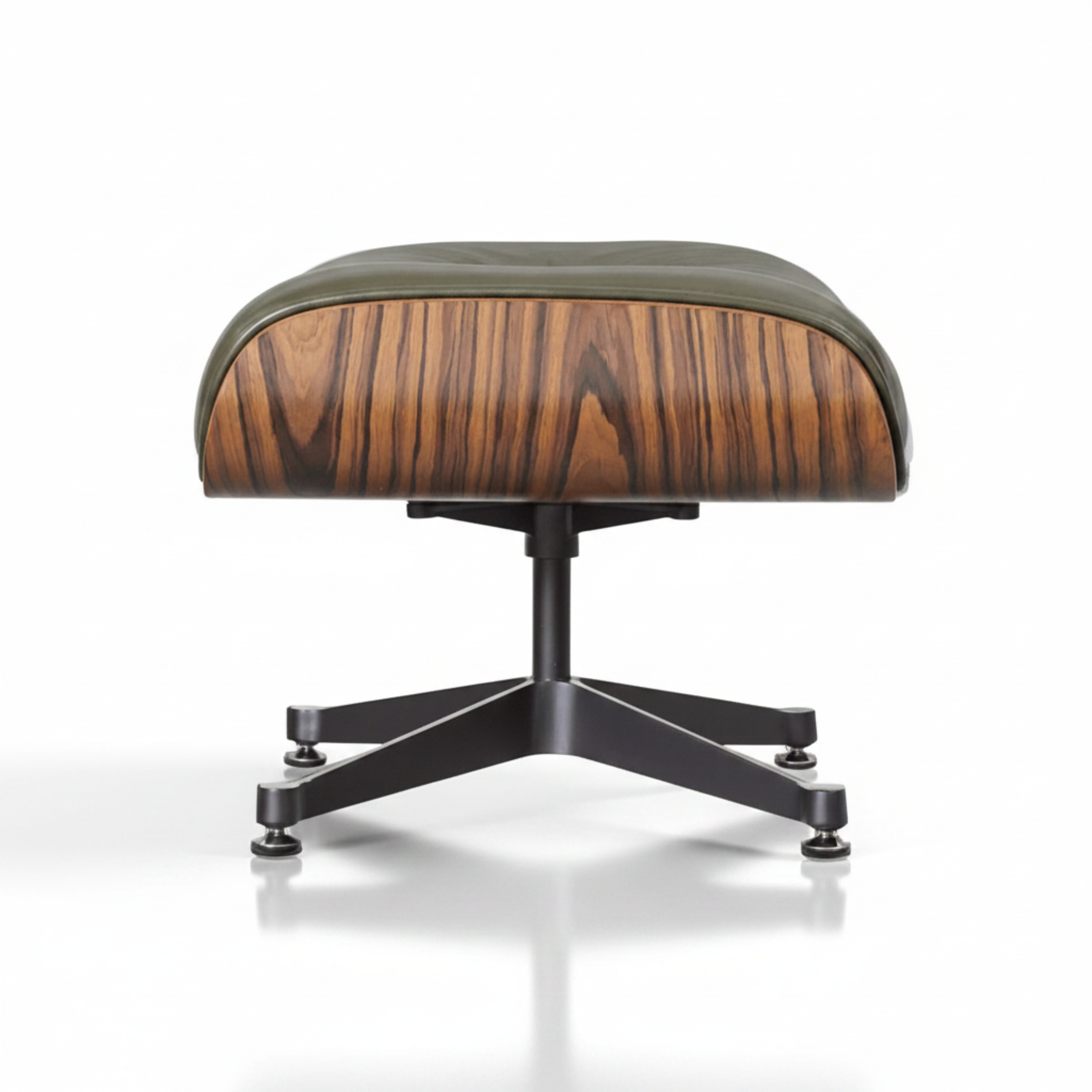 A modern lounge ottoman with a curved seat upholstered in olive green leather