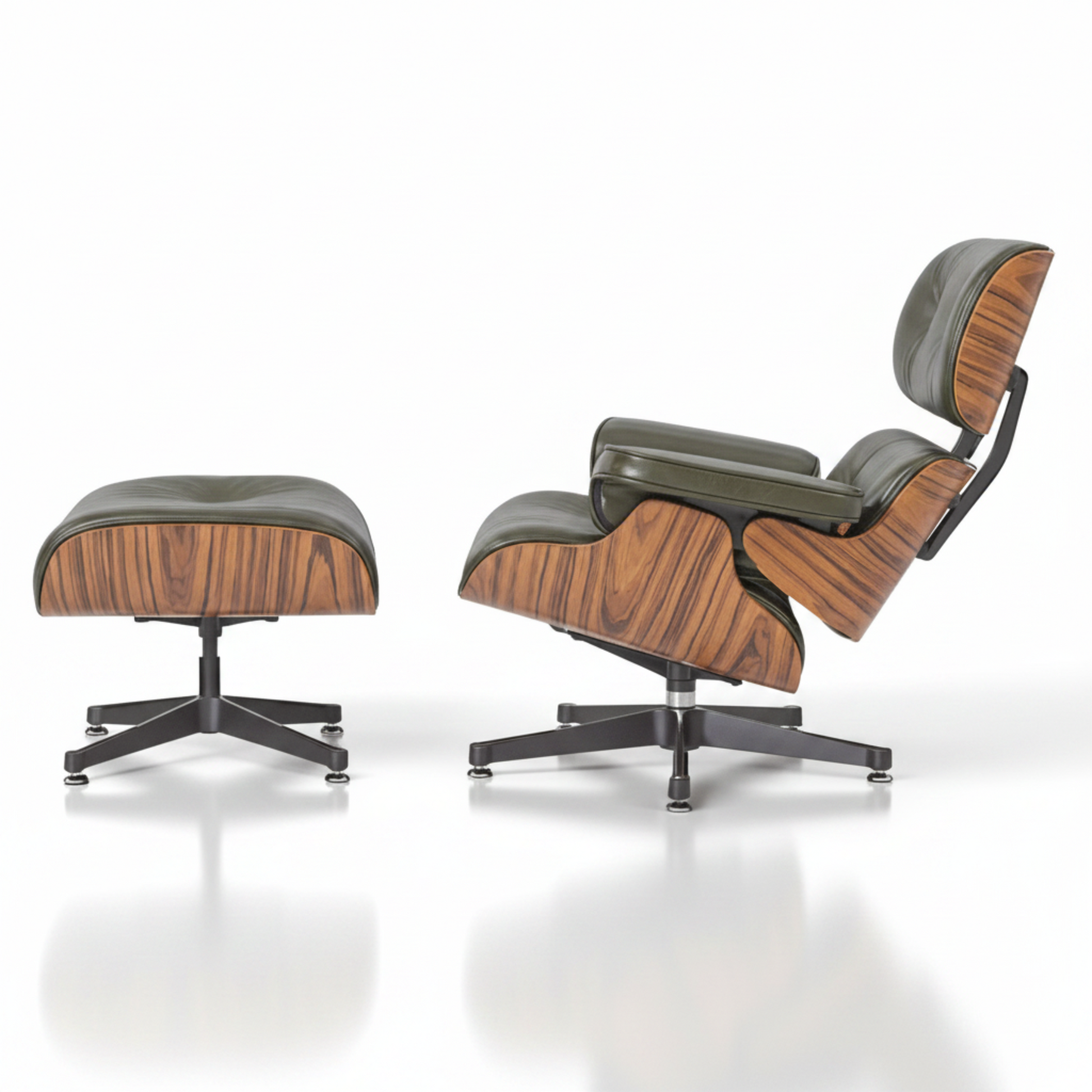 A classic Eames-style lounge chair with an ottoman, featuring dark olive green leather upholstery 