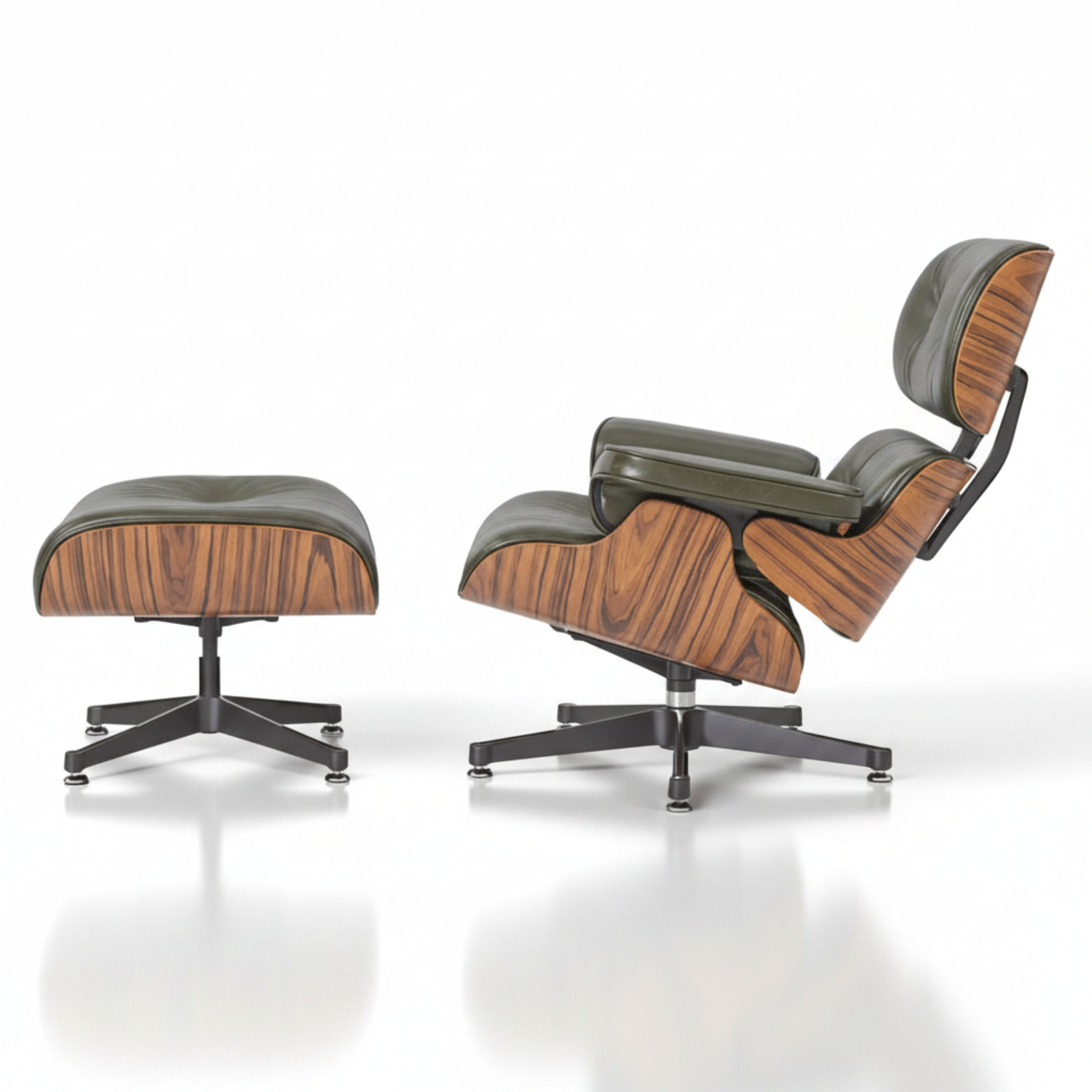 A classic Eames-style lounge chair with an ottoman, featuring dark olive green leather upholstery 
