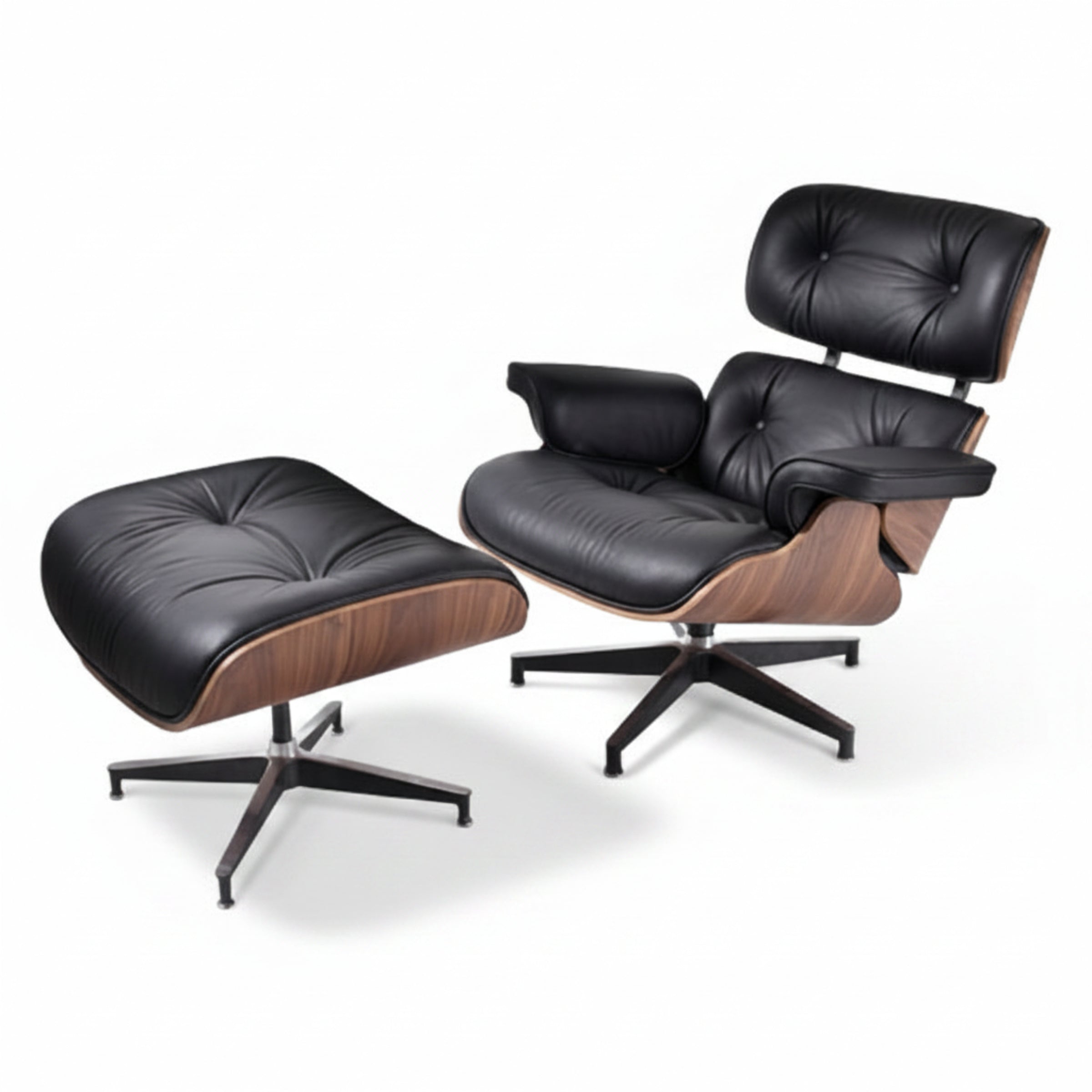 Black leather lounge chair and ottoman on a white background