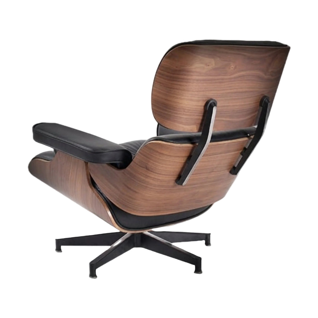 Black leather lounge chair and ottoman on a white background