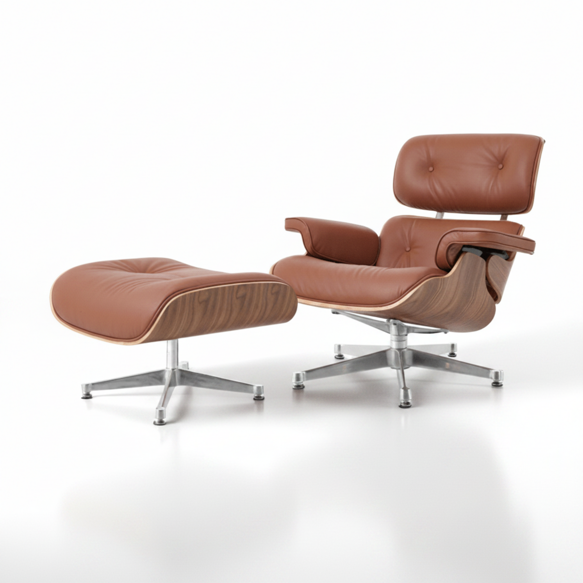 Brown leather lounge chair and ottoman on a white background