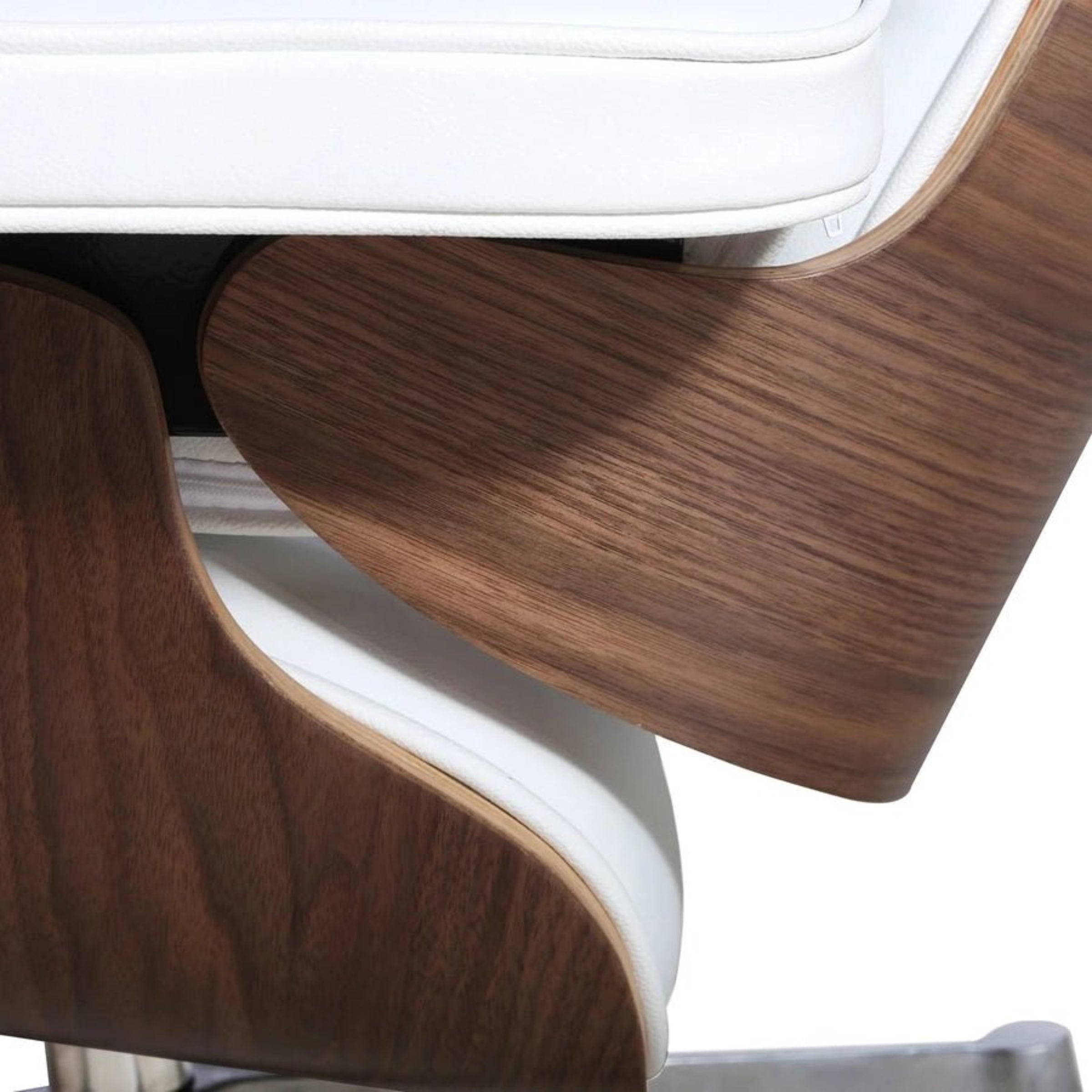 Close-up of a modern chair with wooden armrests and white cushioned seat