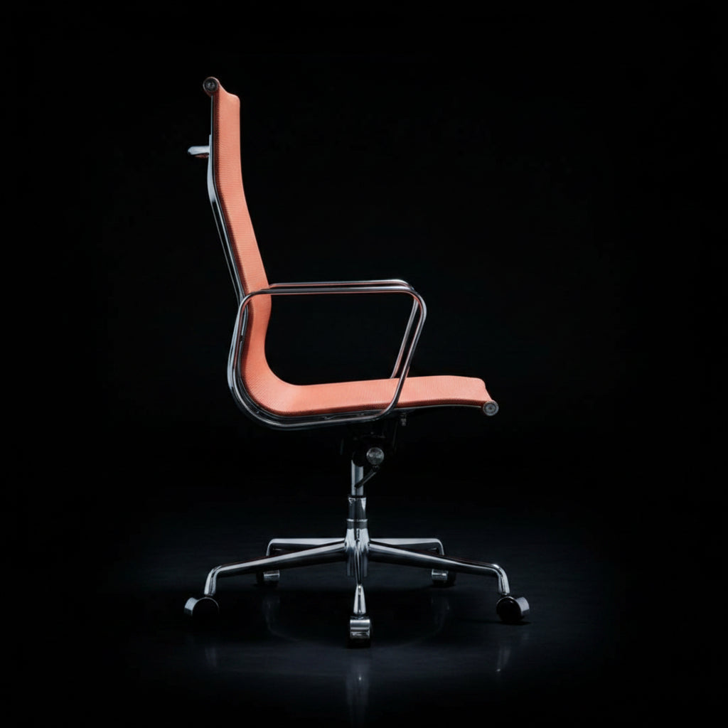A modern office chair with a curved orange-pink upholstered seat and backrest, supported by a chrome five-star base