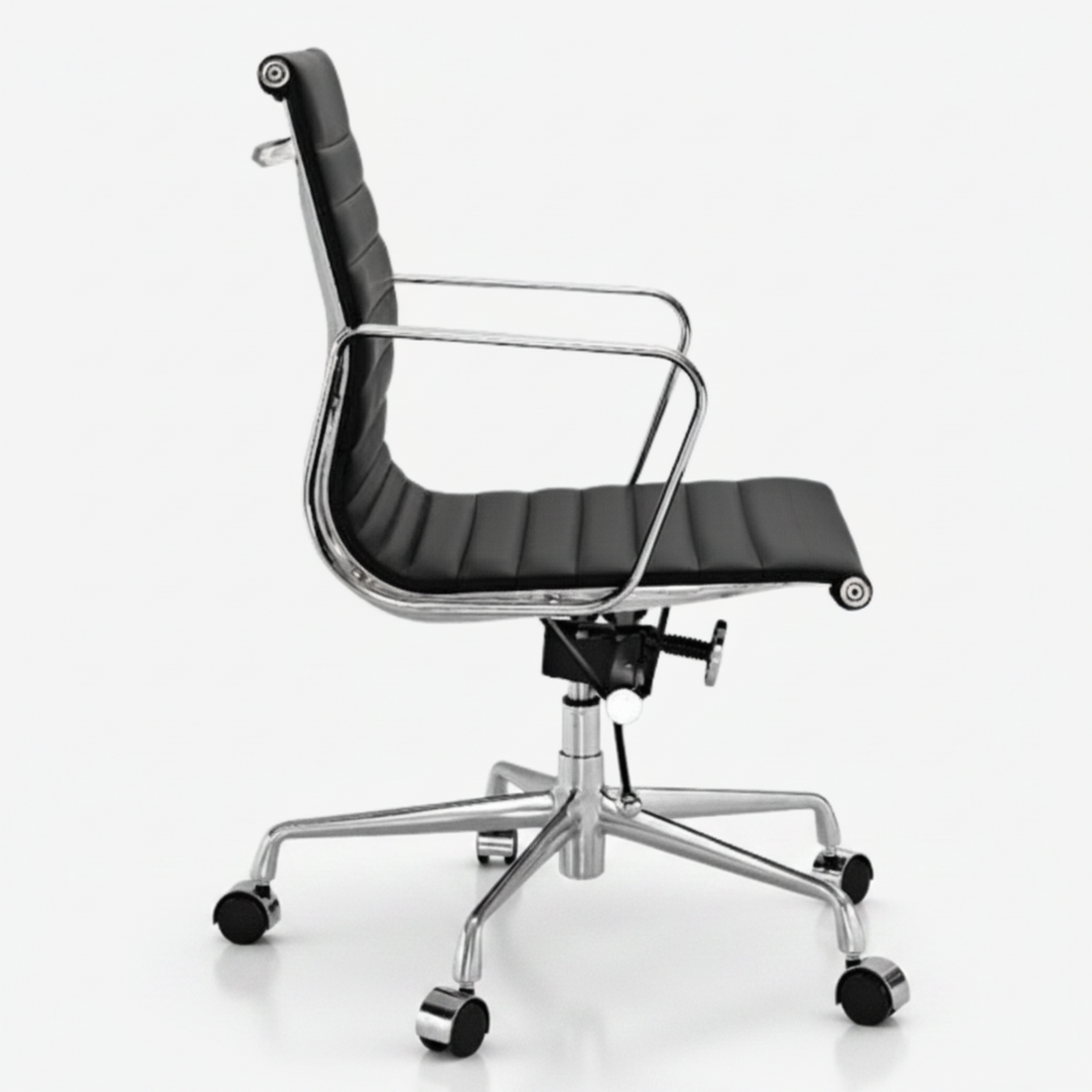 A modern black leather office chair with a high ribbed backrest, chrome metal armrests, and a five-star wheeled base