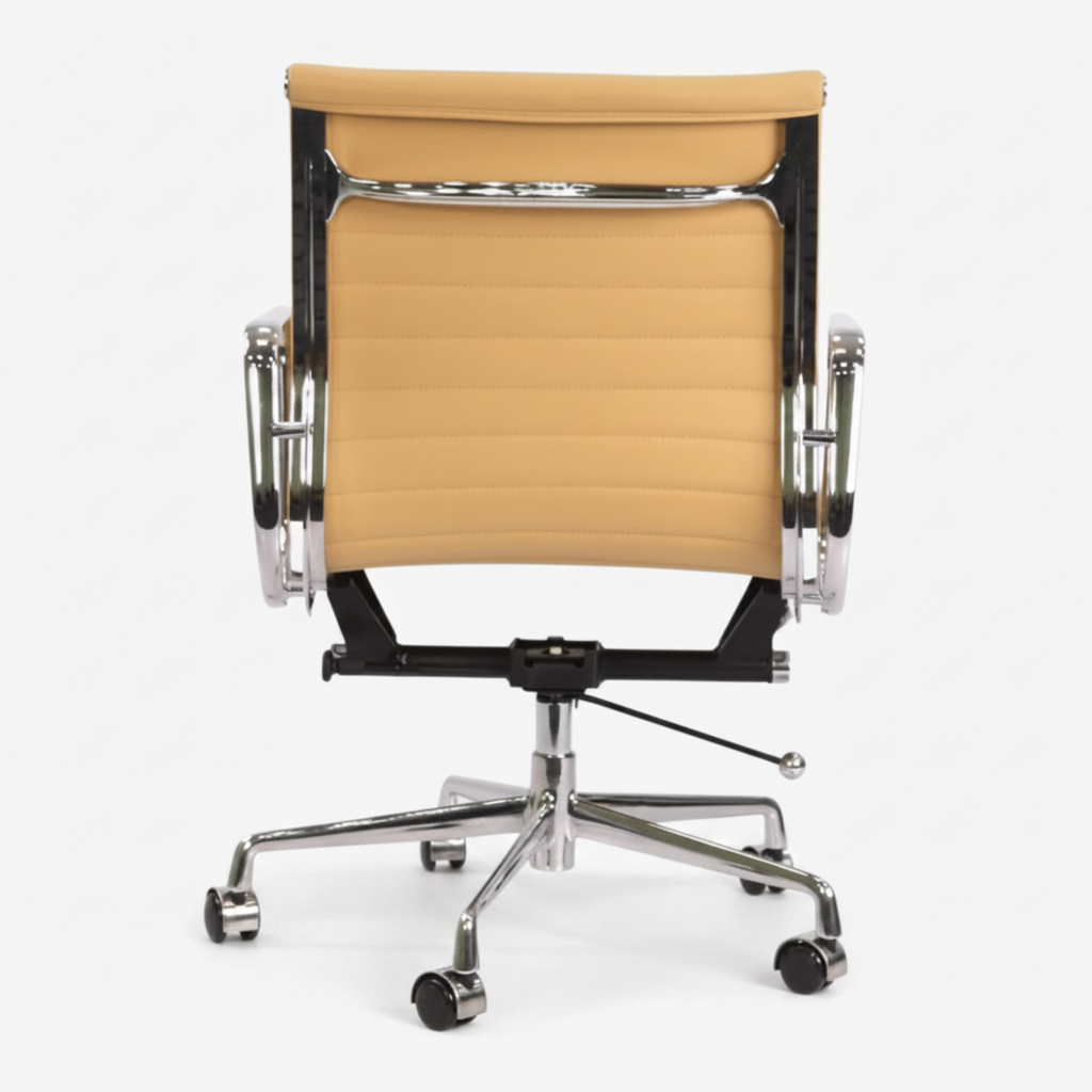 A modern office chair with a curved backrest upholstered in tan leatherette, supported by a black metal frame and chrome five-star base.