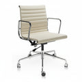 A modern office chair with a cream-colored padded seat and backrest, featuring a chrome-finished metal frame 