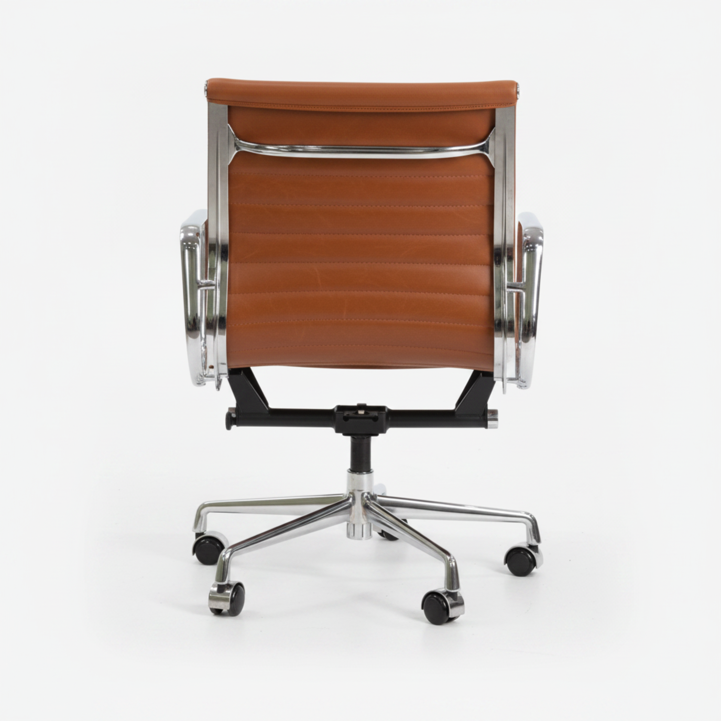 A modern office chair with a brown leather seat and backrest, supported by a polished chrome five-star base with casters