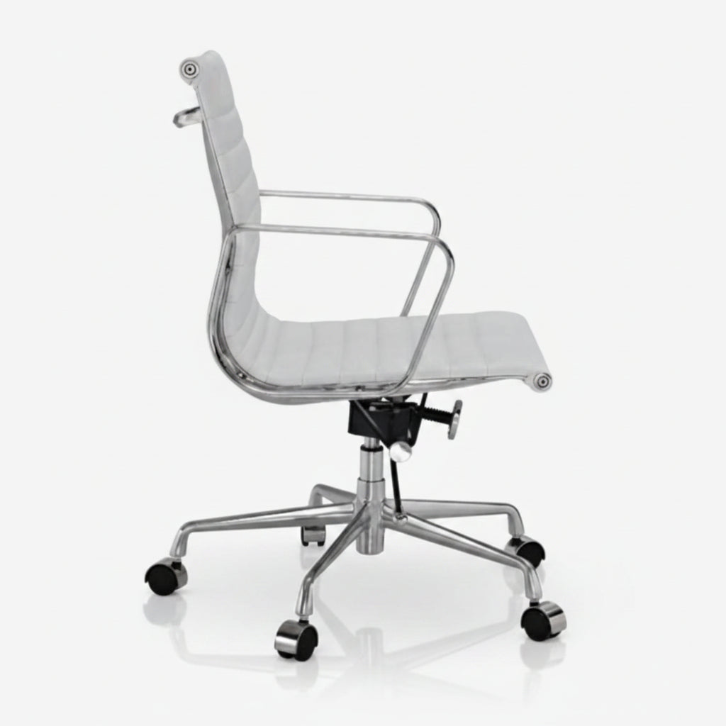 A modern office chair with a white padded seat and backrest, supported by a polished chrome five-star base