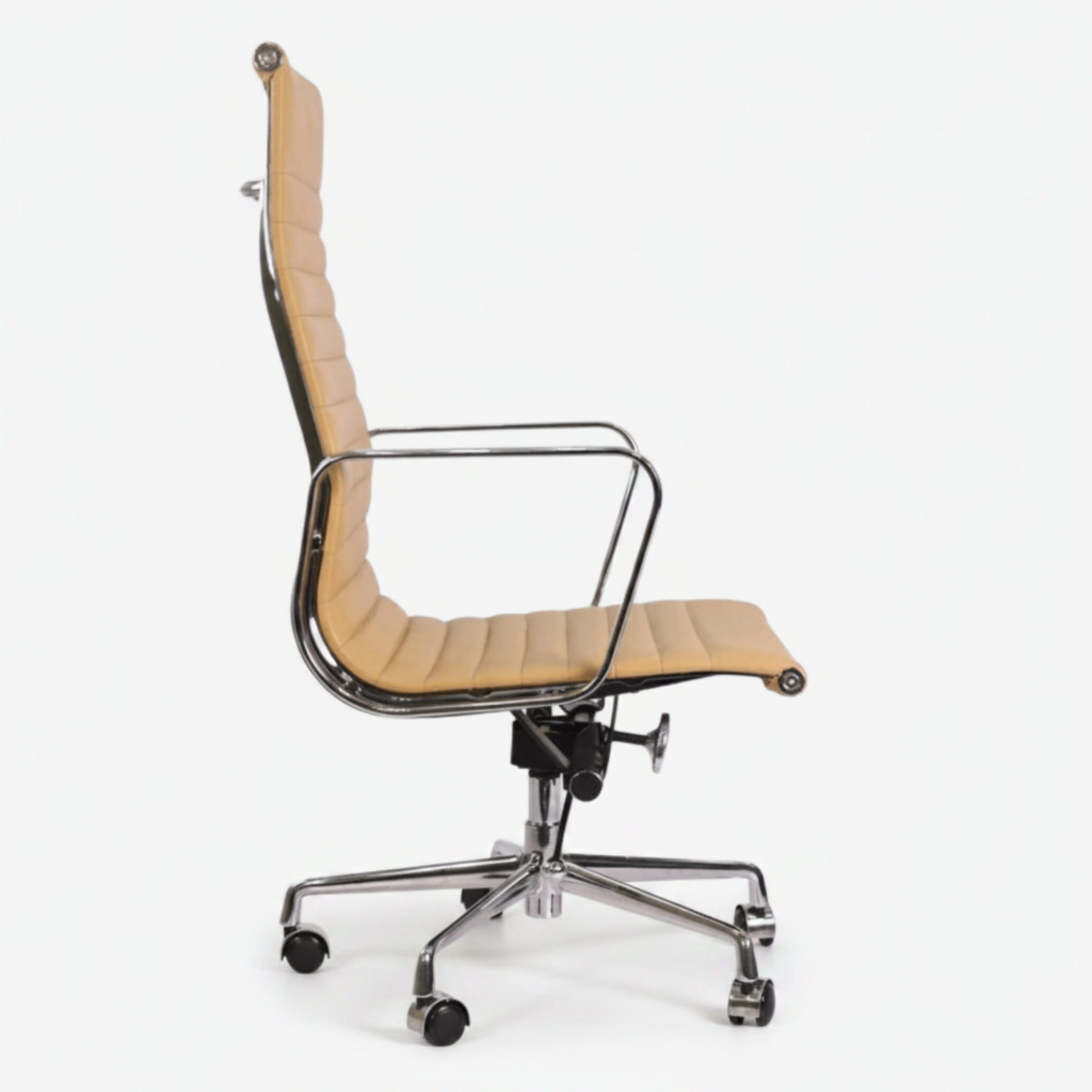 A modern high-back office chair with a curved, ribbed tan leather seat and backrest, supported by a polished chrome five-star base with casters.