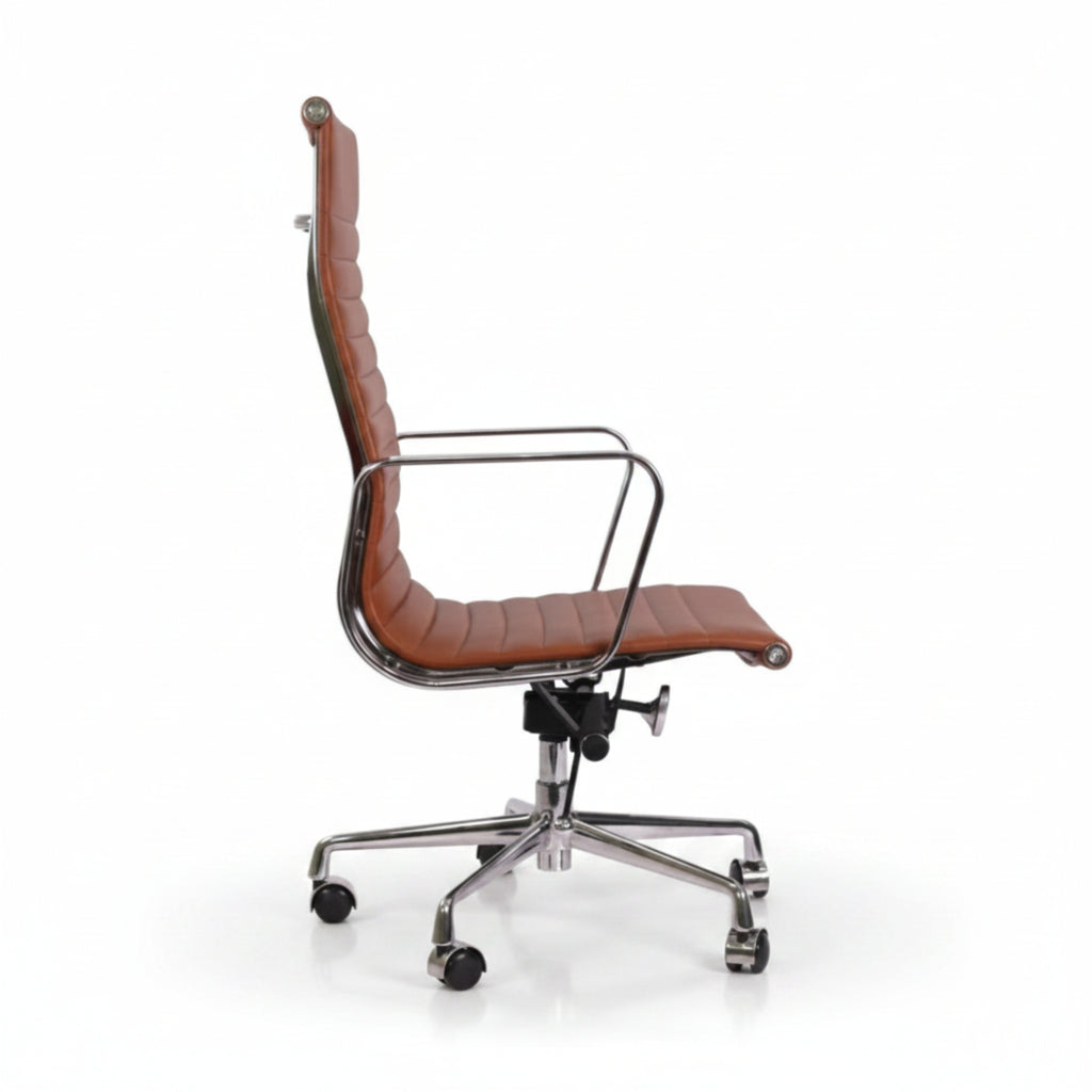 A modern high-back office chair with brown leather upholstery and a polished chrome metal frame, armrests, and a five-star wheeled base