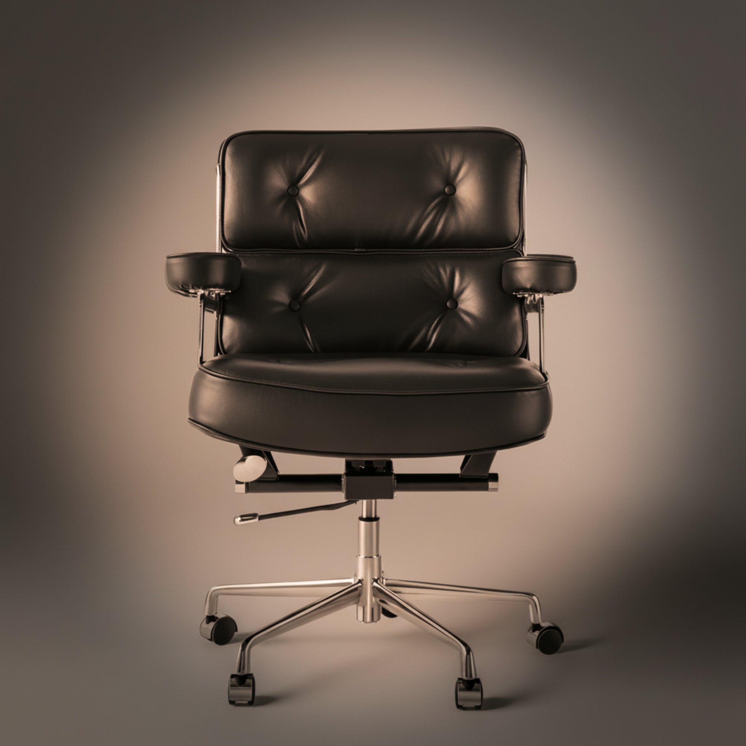 A executive-lobby-office-chair-es104-black with a tufted backrest, padded armrests, and a chrome five-star wheeled base